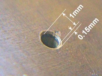 A bevelled edge to the one millimeter diameter pinnule resulting in a 0.15mm or 7-8 minute error.