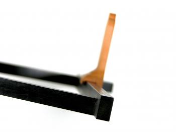 The frame is asymmetrical to allow the vanes to 'grab' it.
