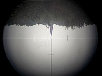 The view of the Wild T1 is inverted with a reticle similar to the Carl Zeiss Th1.