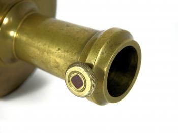 The base can be fixated to a tripod or staff using this brass and steel screw.