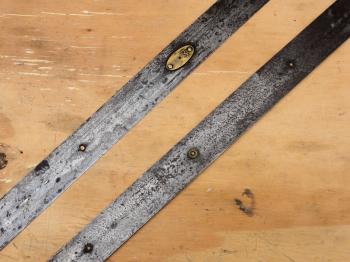 A section of the tape showing the various rivets and a whole metre plate.