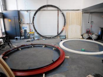 The steel base circle and pine plywood cladding. Against the wall the steel track.