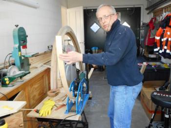 Bending the pine strips using a rolling mill.