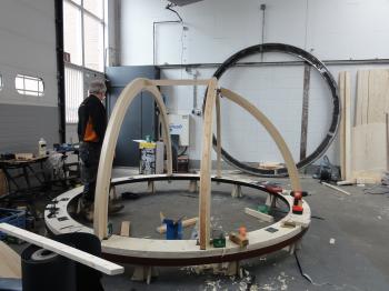 The two main rafters and the first side rafter mounted on the base.
