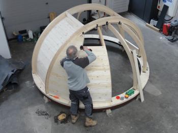 Cladding the rafters with pine plywood.