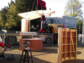 The prefab elements being loaded for transport.