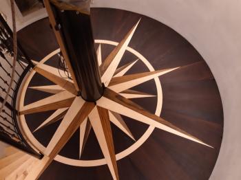 The floor of InFINNity Deck in Wengé, Amazakoue, and Maple.