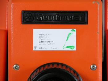 The Geodimeter is labelled with a sticker of its former owner.